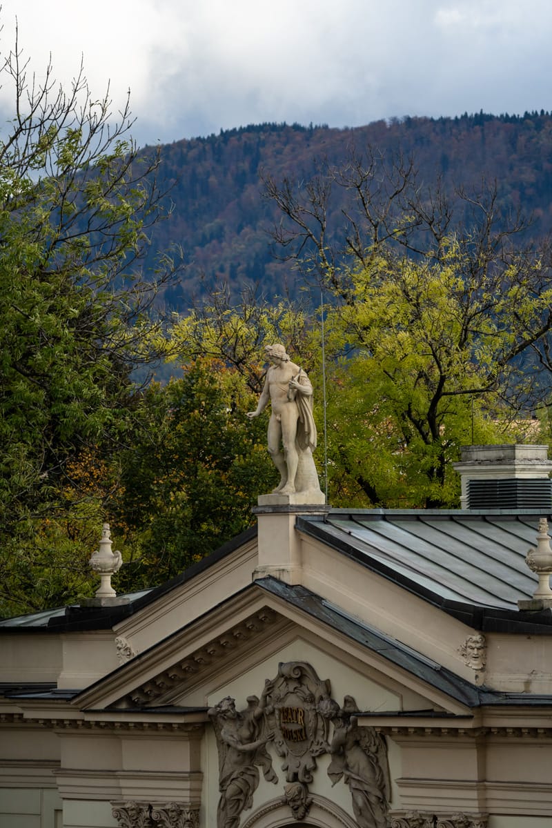 Statue on top of historic building