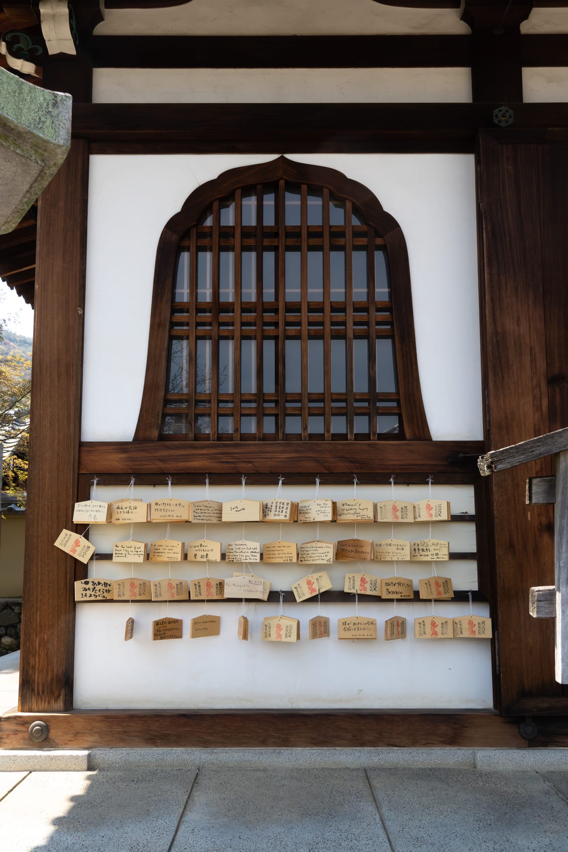 photo of shrine window with hanging ema